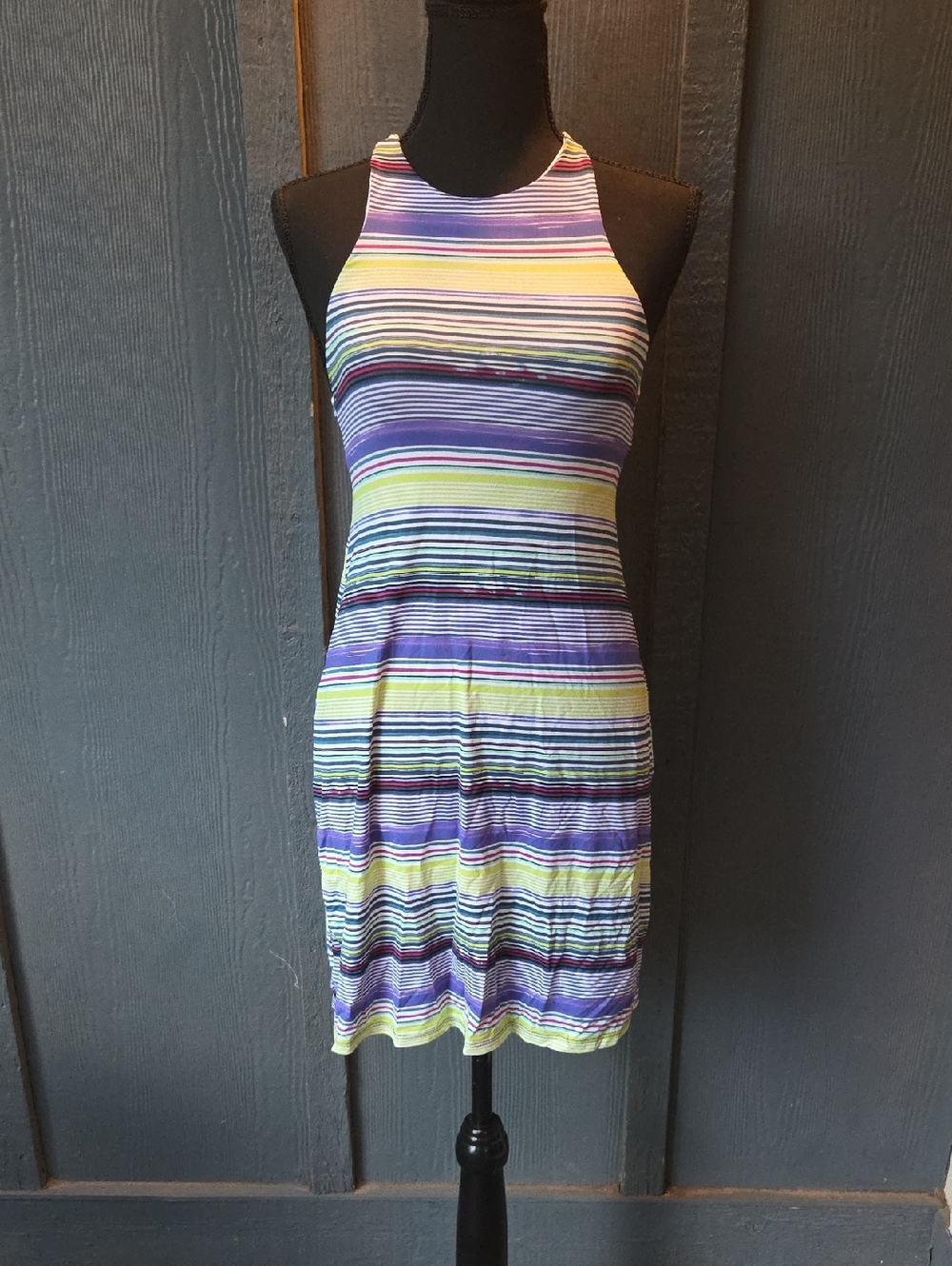 Carve Designs Striped Halter Mini Dress in Purple, Lime, And Black.